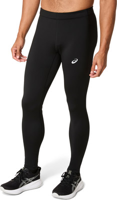 Ein Mann in schwarzen Lauftights und Asics-Laufschuhen. Ein Mann in schwarzen Lauftights und Asics-Laufschuhen.