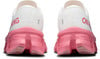 Rückansicht von weißen Laufschuhen mit pinker Sohle und Aufschrift „RUNNING“.