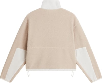 Beige Fleecejacke mit weißen Ärmeleinsätzen und weißem Kragen. Beige Fleecejacke mit weißen Ärmeleinsätzen und weißem Kragen.