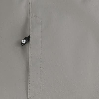 Detail látky s jemným vzorem rybí kosti a zipem. Detail látky s jemným vzorem rybí kosti a zipem.