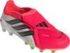 Rosa Adidas Predator Fußballschuhe mit ikonischen Streifen und Klettverschluss.