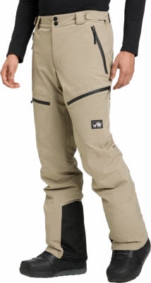 Beige Skihose mit schwarzen Reißverschlüssen und Logo am Oberschenkel. Beige Skihose mit schwarzen Reißverschlüssen und Logo am Oberschenkel.