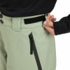 Detail einer Skihose mit Reißverschlusstasche und Klettverschluss am Bund.