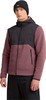 Ein Mann in schwarzer Mütze und rosa Fleecejacke mit schwarzer Kapuze.