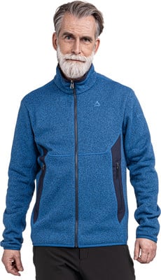 Ein Mann mittleren Alters mit grauem Haar und Bart in einer blauen Fleecejacke. Ein Mann mittleren Alters mit grauem Haar und Bart in einer blauen Fleecejacke.