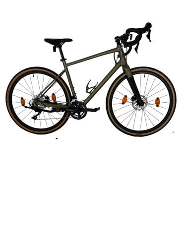 Grünes Gravelbike mit schwarzen Akzenten und braunen Reifen.