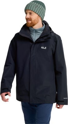 Ein Mann in einer dunklen Jacke, blauer Hose und grün gestreifter Mütze. Ein Mann in einer dunklen Jacke, blauer Hose und grün gestreifter Mütze.