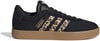 Fekete Adidas cipő leopard mintával az oldalakon és barna talppal.
