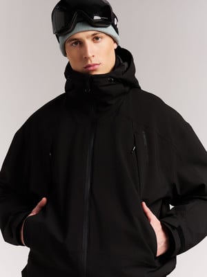 Mann in schwarzer Skijacke und Skibrille. Mann in schwarzer Skijacke und Skibrille.