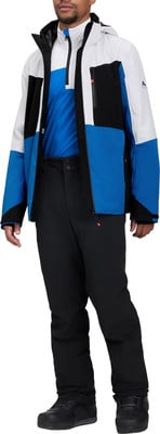 Ein Mann in einer farblich blockierten Skijacke und Hose. Ein Mann in einer farblich blockierten Skijacke und Hose.