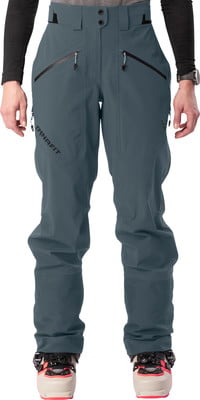 Blaue Skihose mit schwarzen Reißverschlüssen und Dynafit-Logo. Blaue Skihose mit schwarzen Reißverschlüssen und Dynafit-Logo.