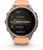 Eine Garmin Smartwatch mit orangefarbenem Armband und Aktivitätsmenü.
