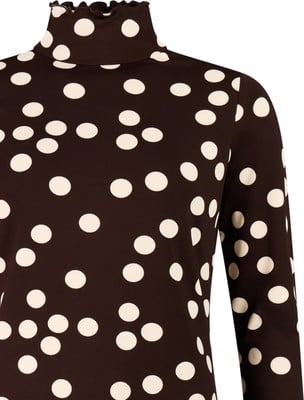 Dunkelbraunes Shirt mit weißen Punkten und Rollkragen. Dunkelbraunes Shirt mit weißen Punkten und Rollkragen.