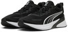 Schwarze Puma-Schuhe mit weißem Streifen und weißer Sohle.