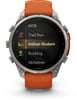 Eine Garmin-Smartwatch mit orangefarbenem Armband zeigt eine Aktivitätsliste an.