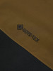Detail des GORE-TEX-Logos auf braun-schwarzem Stoff.
