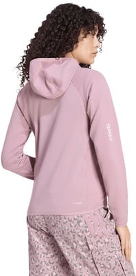 Damen-Kapuzenpullover in Rosa mit Terrex-Logo auf dem Ärmel. Damen-Kapuzenpullover in Rosa mit Terrex-Logo auf dem Ärmel.