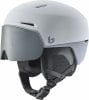 Ein grauer Skihelm mit integriertem Visier und verstellbarem Riemen.