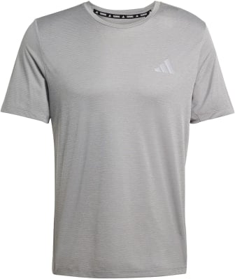 Graues Adidas-T-Shirt mit Logo auf der Brust und Streifenmuster. Graues Adidas-T-Shirt mit Logo auf der Brust und Streifenmuster.
