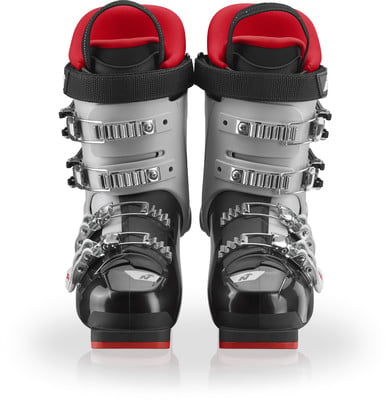 Skischuhe mit rotem Innenfutter und silbernen Schnallen. Skischuhe mit rotem Innenfutter und silbernen Schnallen.