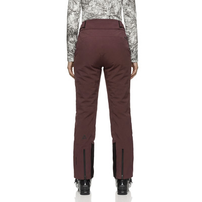 Damen-Skihose in Weinrot mit schwarzen Details und Logo. Damen-Skihose in Weinrot mit schwarzen Details und Logo.